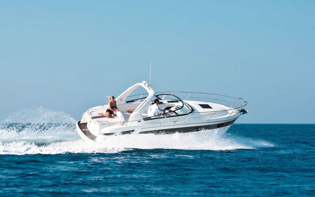 Bavaria 37 boat cruising with a girl. Boats in Paros. Charter a Boat.